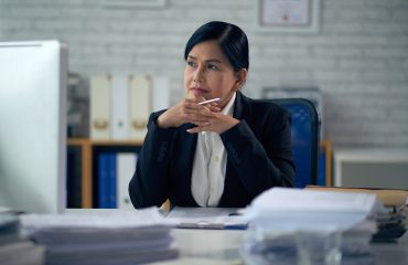 Portrait of pensive female lawyer at her table